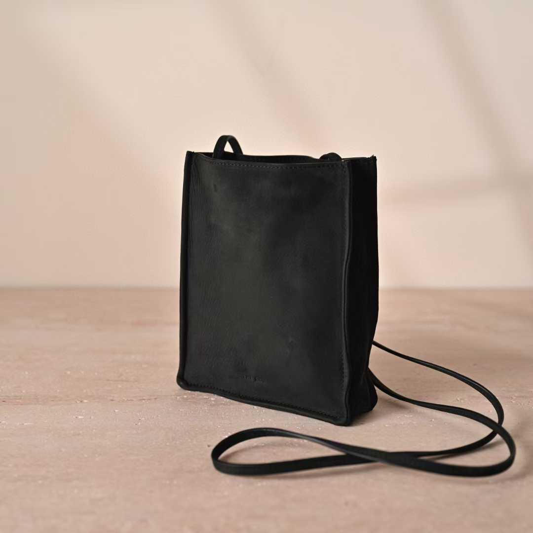 The Row To Go Tote Front suede view 20