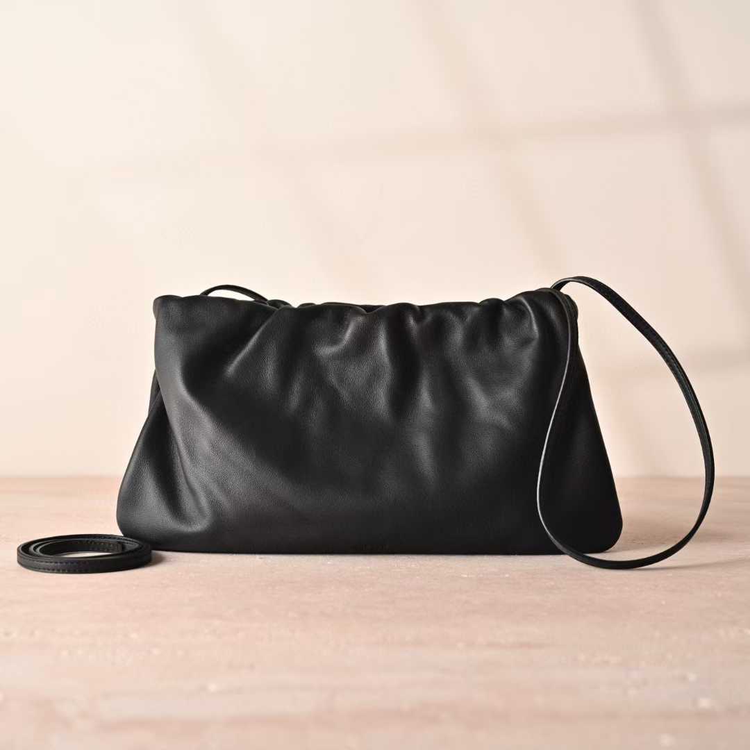 The Row Bourse Clutch Leather handbags view 1