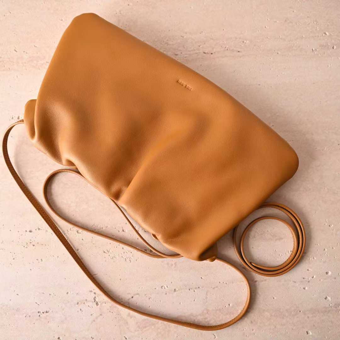 The Row Bourse Clutch Leather handbags view 2